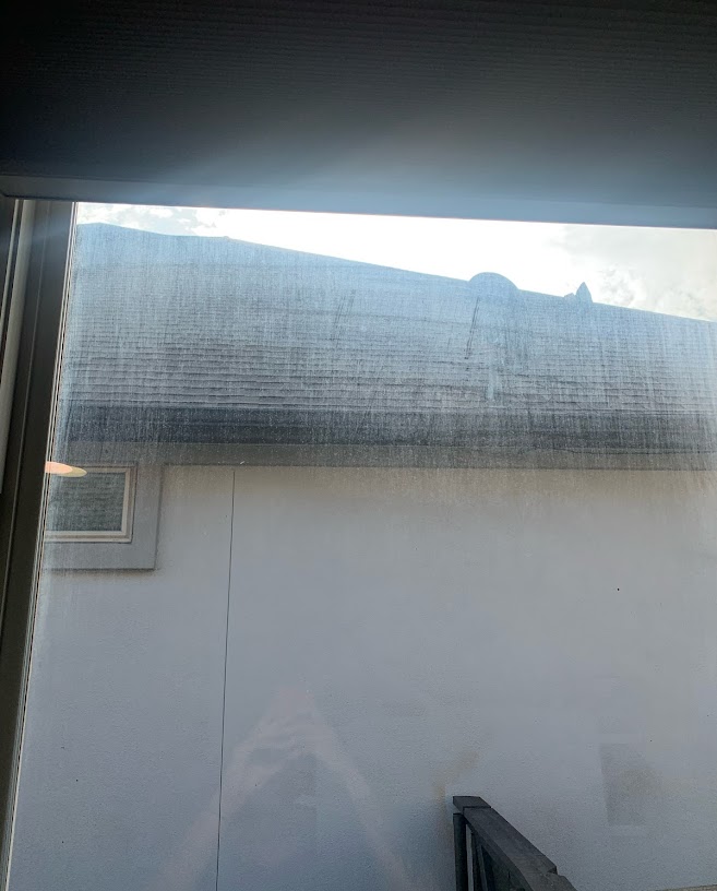 Georgetown home window before Fire Window Cleaning — visible dust, pollen, and water spots